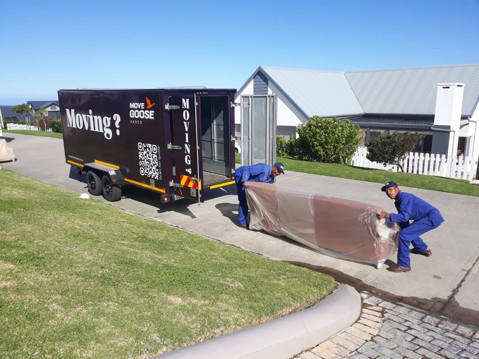 Move Goose team loading furniture for an enclosed removal